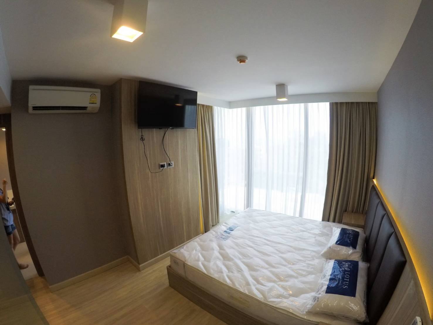 Furnished bedroom with bed, air conditioning and natural light at The Pine Hua Hin