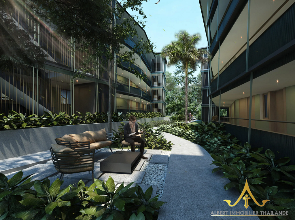 Landscaped tropical courtyard between Wing Samui condominium buildings in Koh Samui